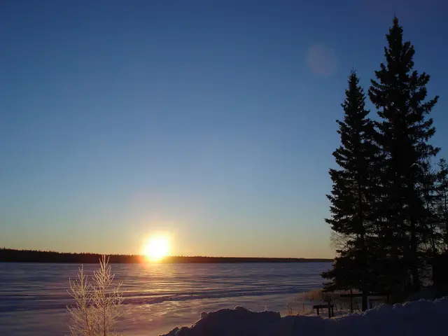 Sunrise over frozen Christopher Lake